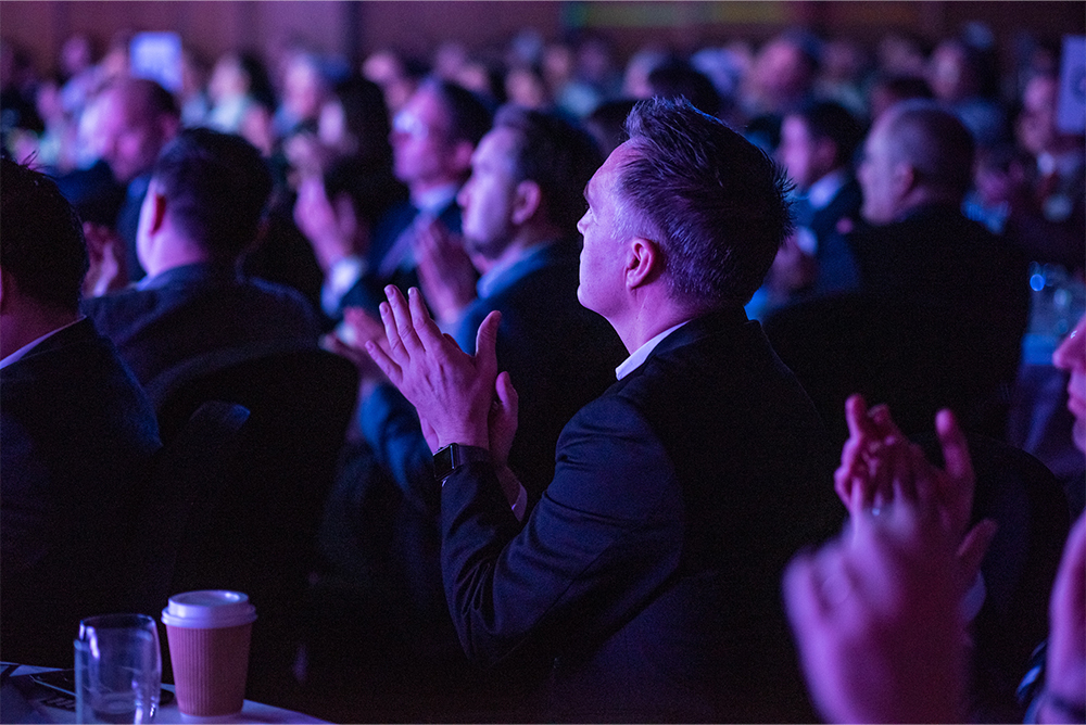 Man in audience clapping